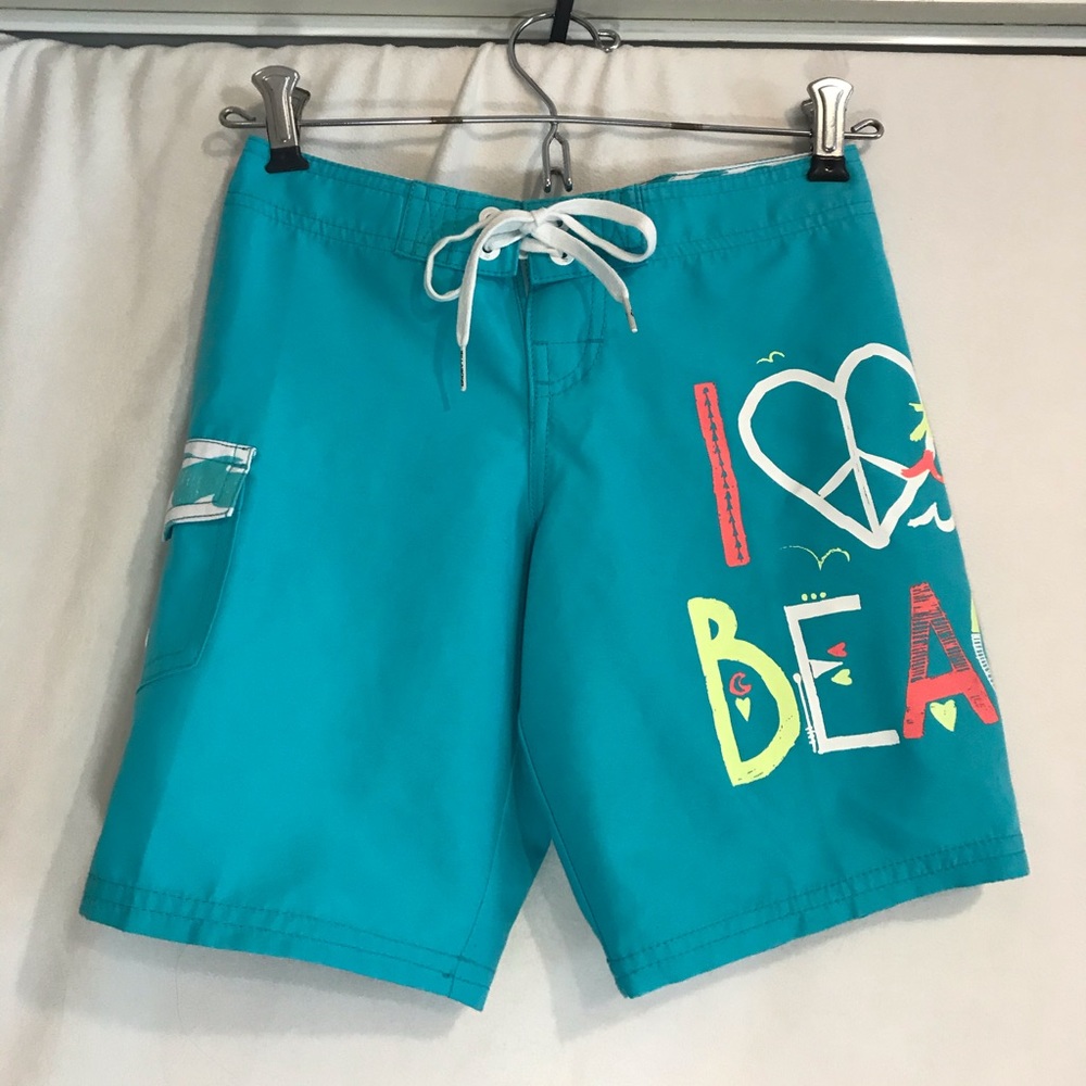 Girls Billabong turquoise beach and swim shorts